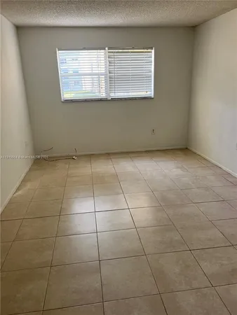 a view of a room that has a window in it