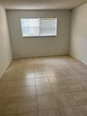 a view of a room that has a window in it