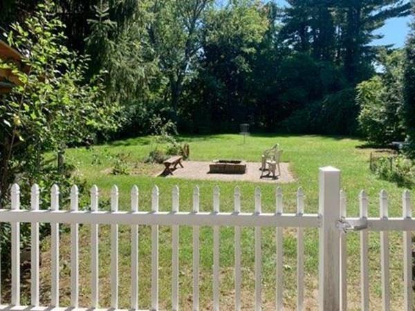 2085 Wilbraham Road Springfield, MA 01129 - Photo 4 of 24 a view of a wooden chairs and fence