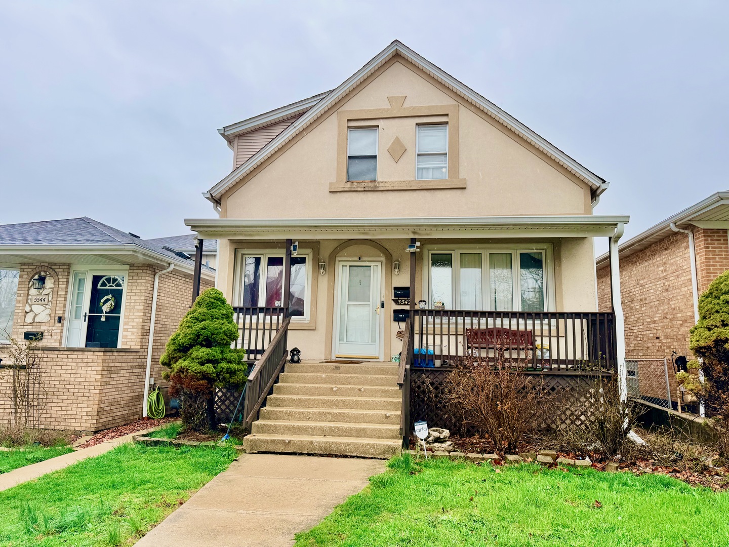 5542 South Nottingham Avenue Chicago, IL 60638 - Photo 1 of 39 a front view of a house with a yard