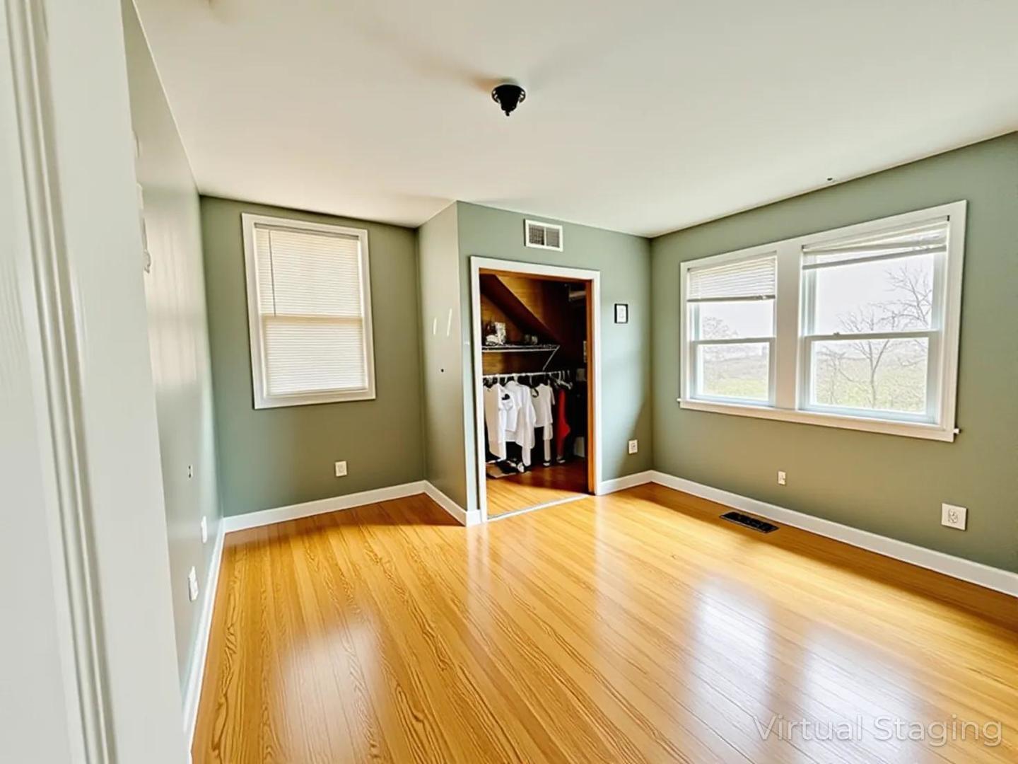 5542 South Nottingham Avenue Chicago, IL 60638 - Photo 12 of 39 a view of an empty room with wooden floor and a window
