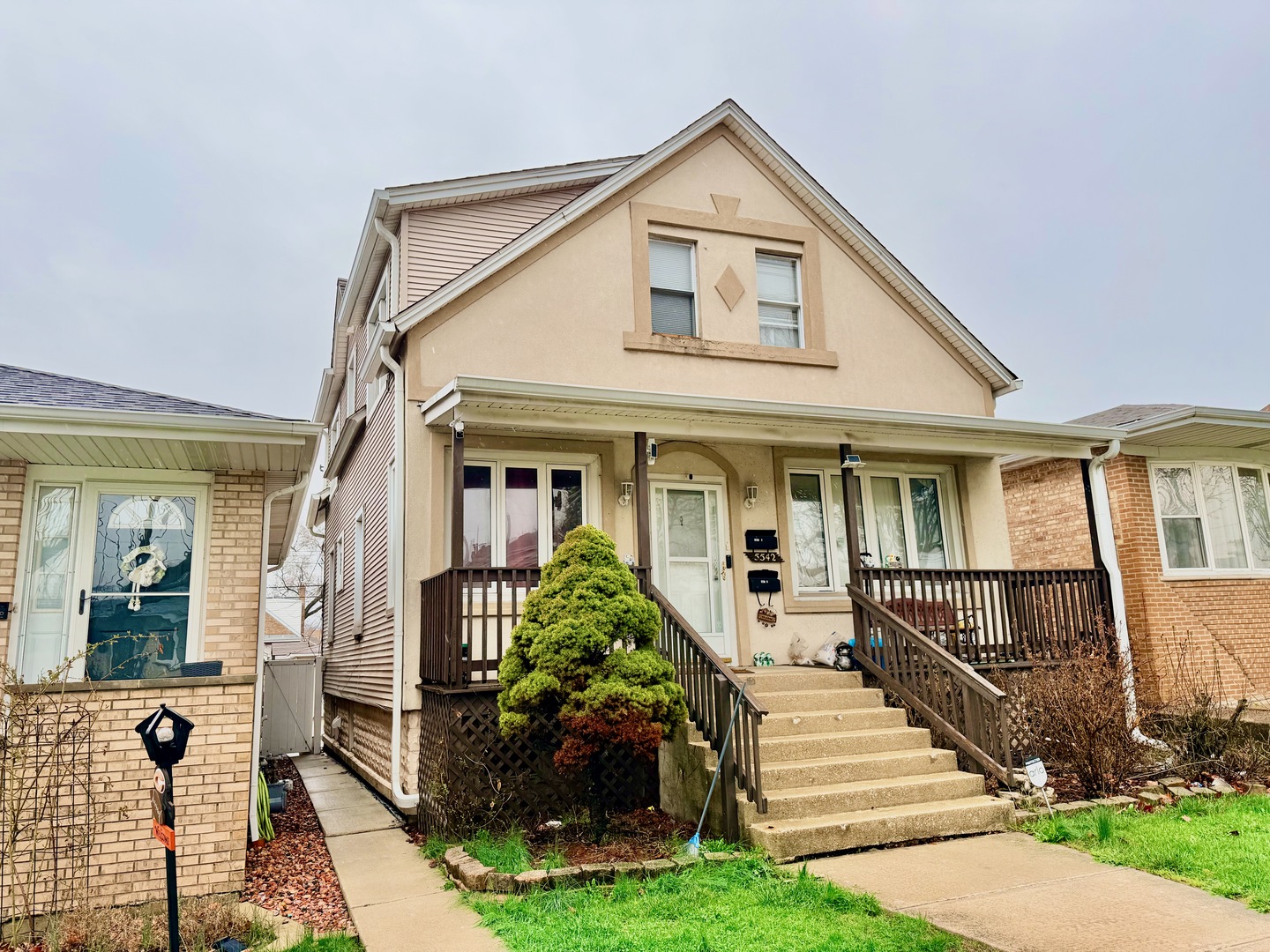 5542 South Nottingham Avenue Chicago, IL 60638 - Photo 2 of 39 a front view of a house with a yard