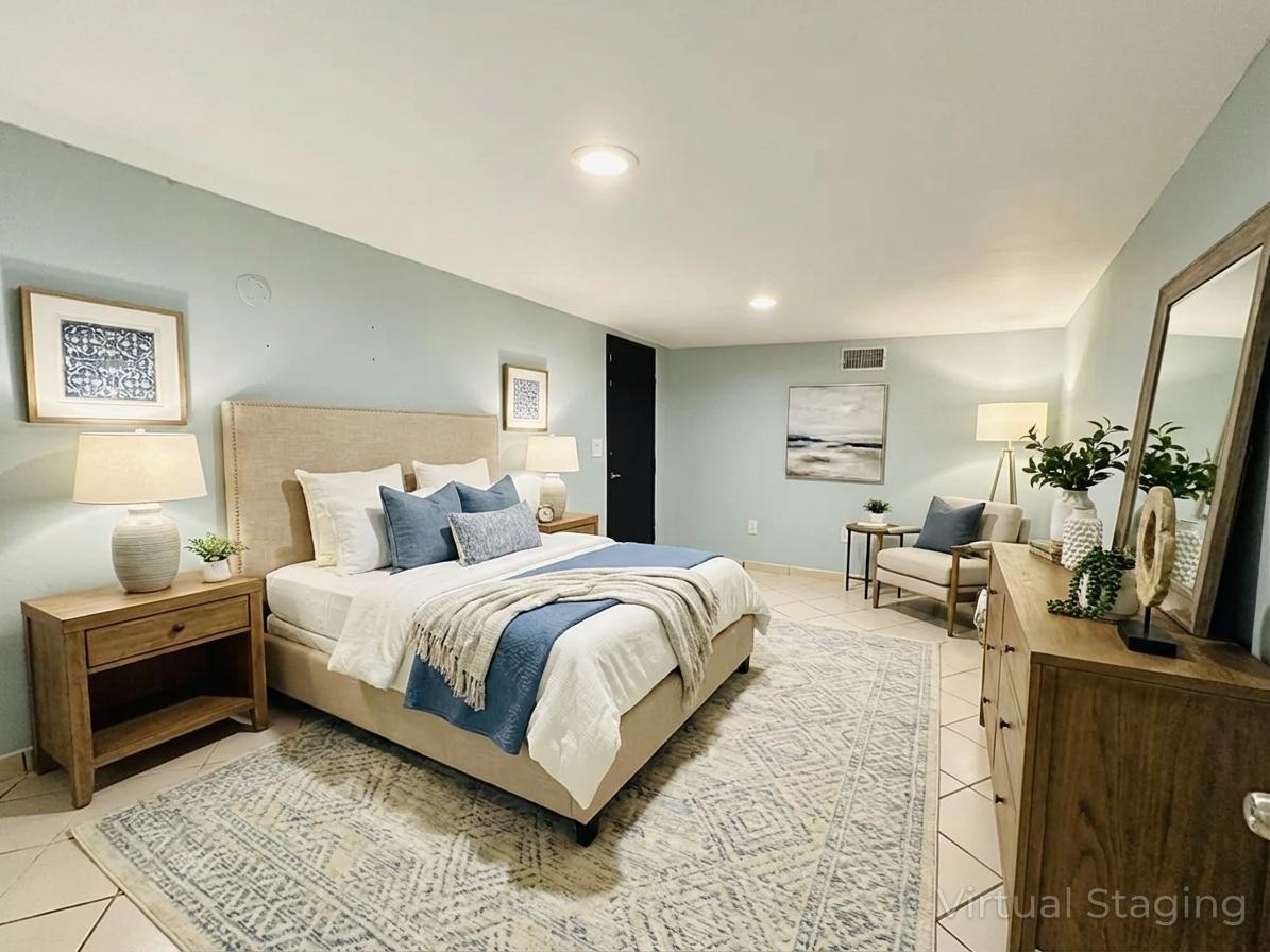 5542 South Nottingham Avenue Chicago, IL 60638 - Photo 33 of 39 a spacious bedroom with a bed a couch and a potted plant