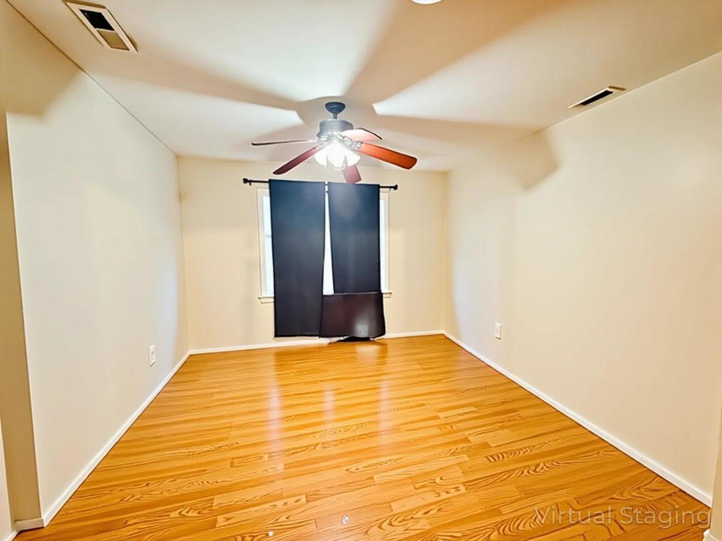 5542 South Nottingham Avenue Chicago, IL 60638 - Photo 4 of 39 a view of a big room with wooden floor