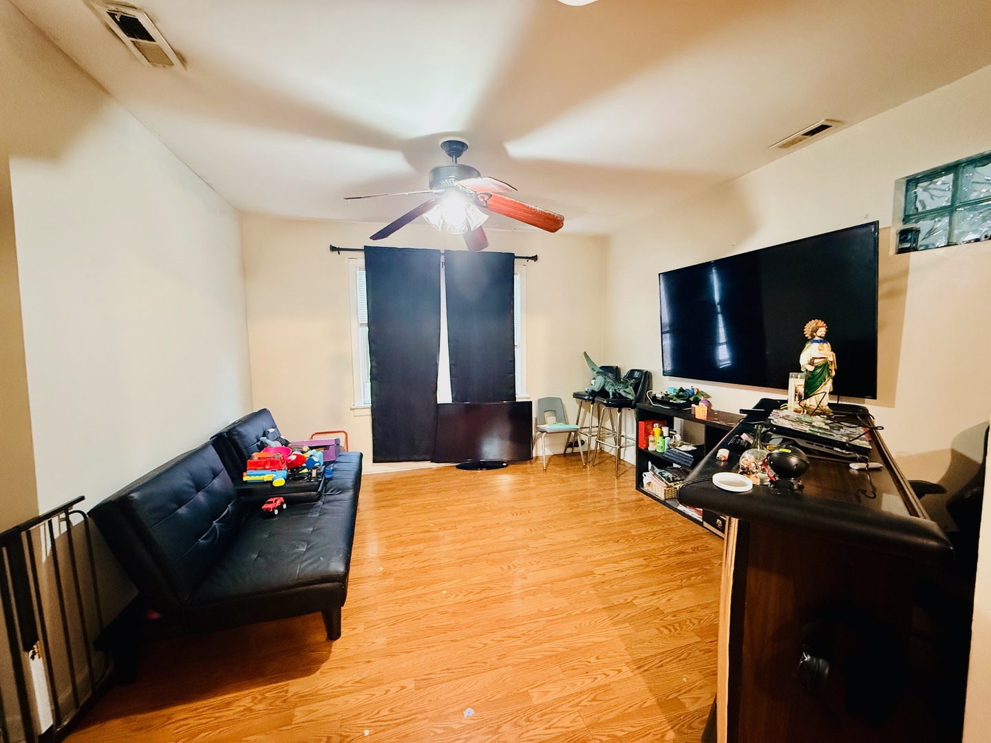 5542 South Nottingham Avenue Chicago, IL 60638 - Photo 6 of 39 a living room with furniture and a flat screen tv