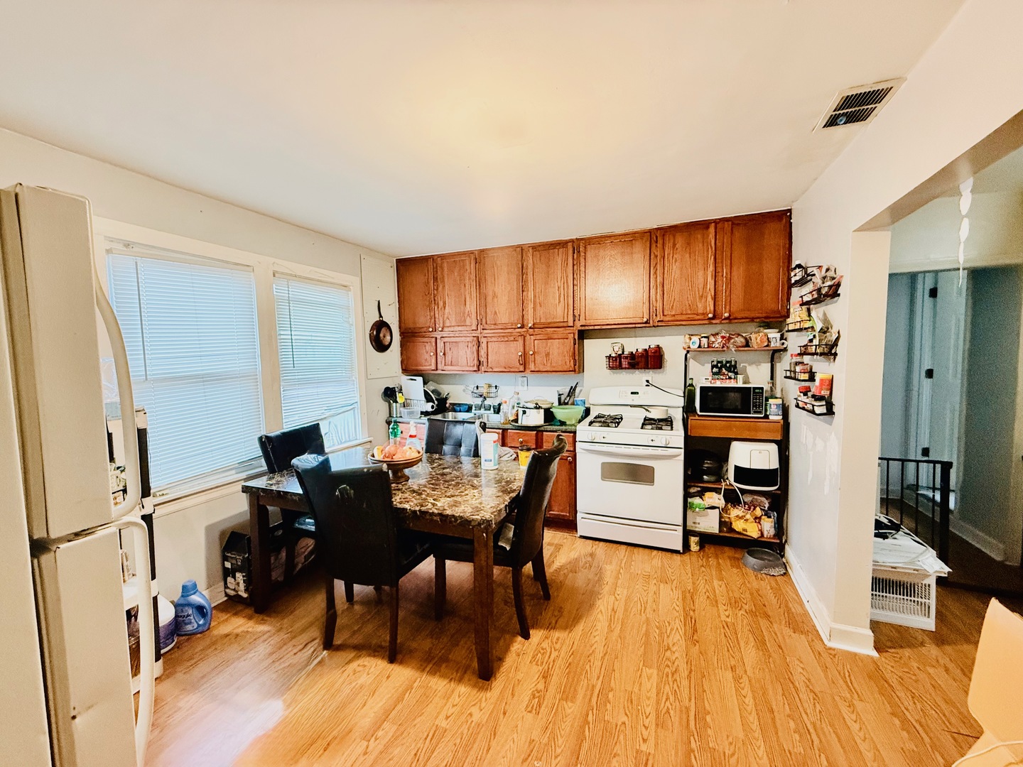 5542 South Nottingham Avenue Chicago, IL 60638 - Photo 9 of 39 a view of a dining room with furniture window and wooden floor