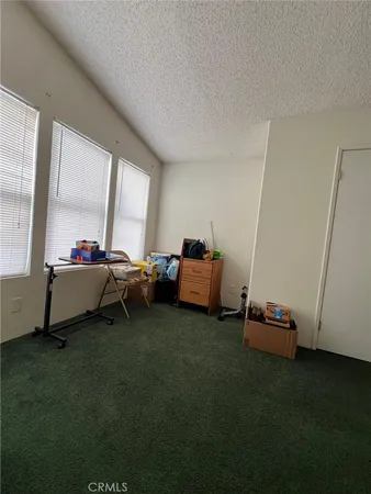 a bed room with a bed and a window
