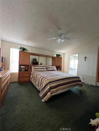 a bedroom with a bed and closet