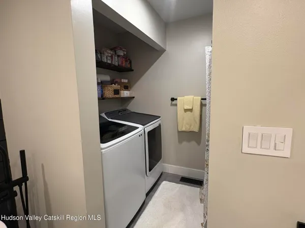 a view of hallway with washer and dryer