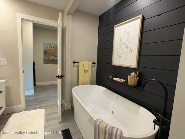 a bathroom with a bathtub and a sink