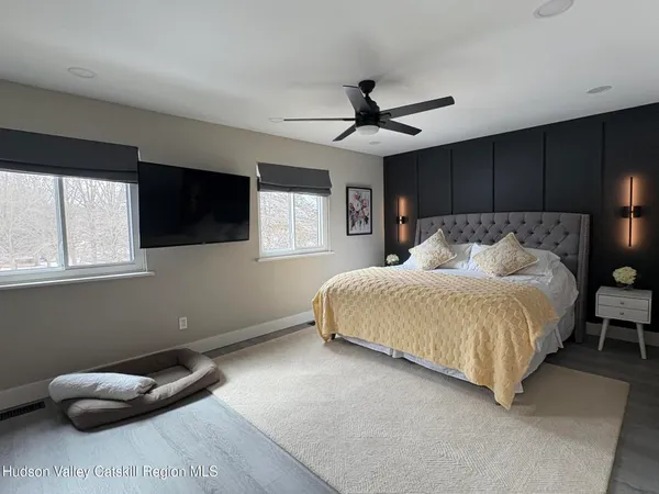 a bedroom with a bed and window