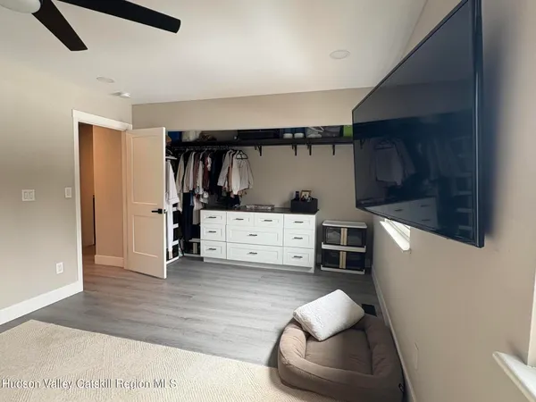 a living room with furniture and a chair