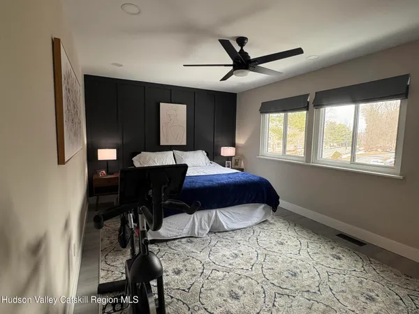 a bedroom with a bed and a table in it