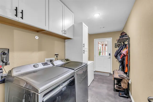 a kitchen that has a stove and a table