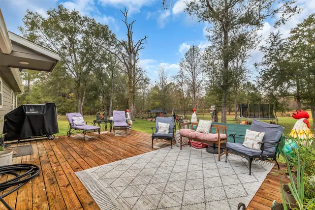 a view of a backyard with sitting area