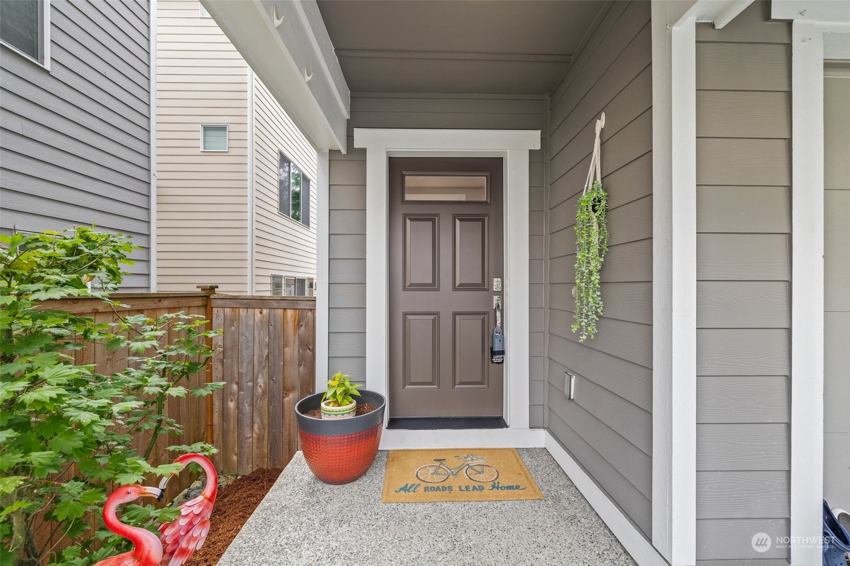 19732 Meridian Place West Bothell, WA 98012 - Photo 2 of 20 a backyard of a house with dining table and chairs