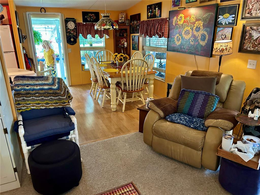 25646 Bass Road Astor, FL 32102 - Photo 26 of 48 a living room with furniture and a painting