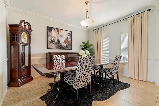 a view of a dining room with furniture and window