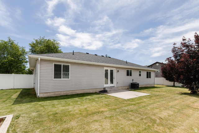1145 West 2640th Street South Logan, UT 84321 - Photo 14 of 17 Spacious green lawn with a white vinyl fence