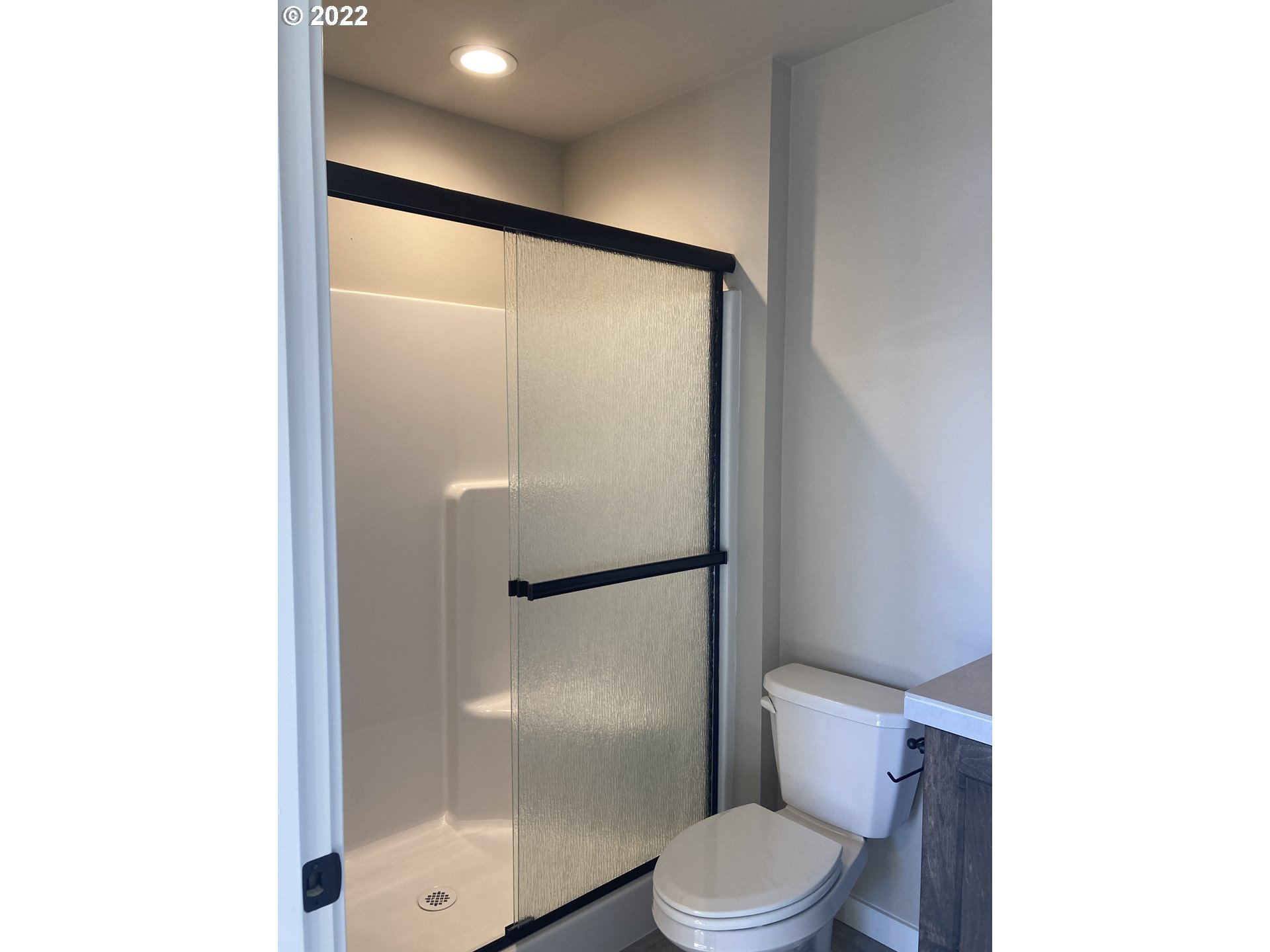7250 South Ridge Way Ridgefield, WA 98642 - Photo 12 of 16 a bathroom with a toilet and a shower