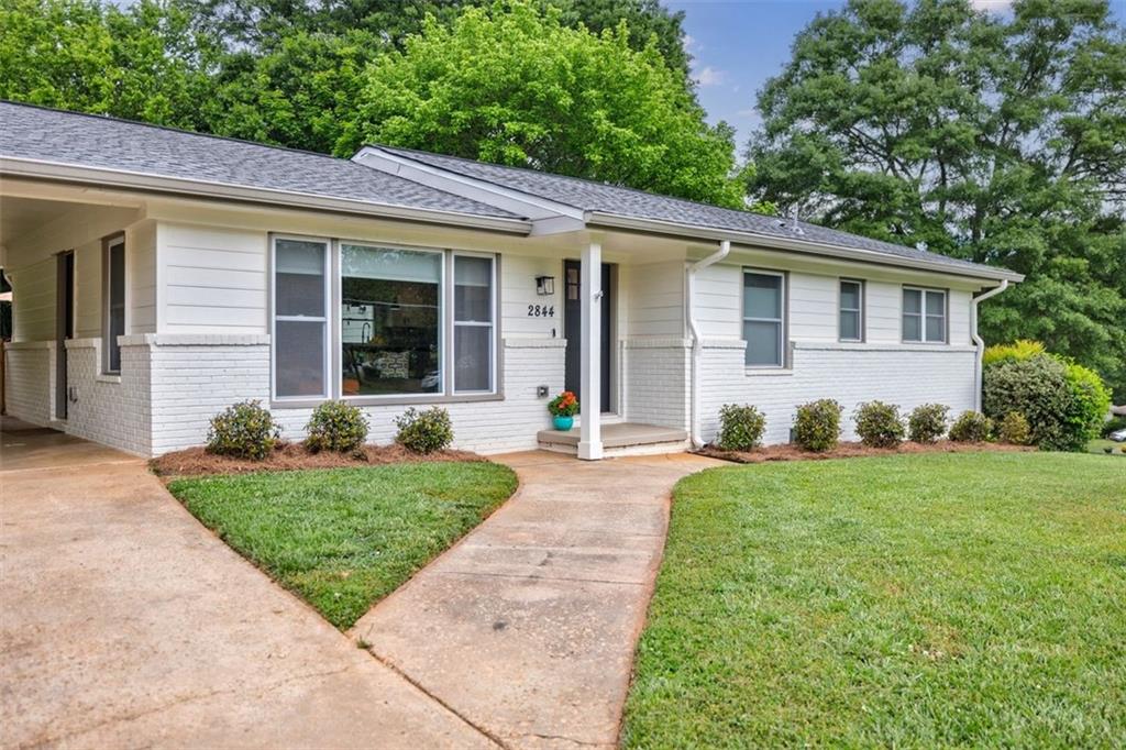 2844 Toney Drive Decatur, GA 30032 - Photo 1 of 1 a front view of a house with a yard and porch