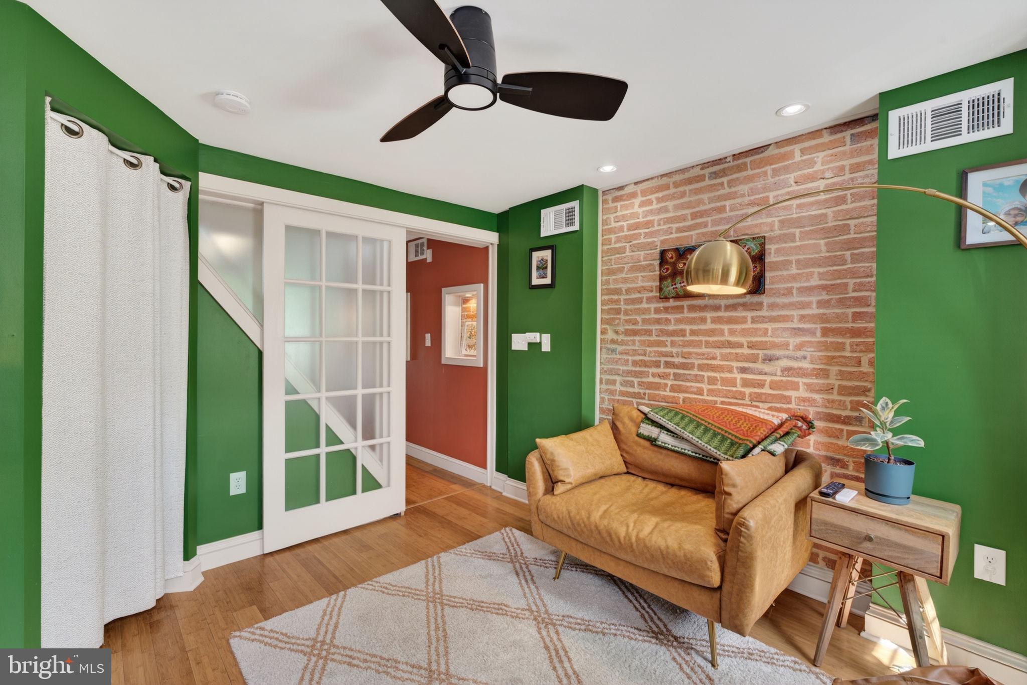 18 South Washington Street Baltimore, MD 21231 - Photo 29 of 57 a view of a livingroom with furniture and a window
