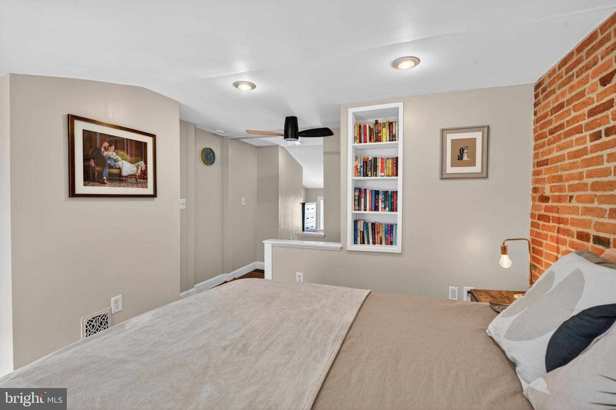 18 South Washington Street Baltimore, MD 21231 - Photo 33 of 57 a bedroom with a bed and a couch