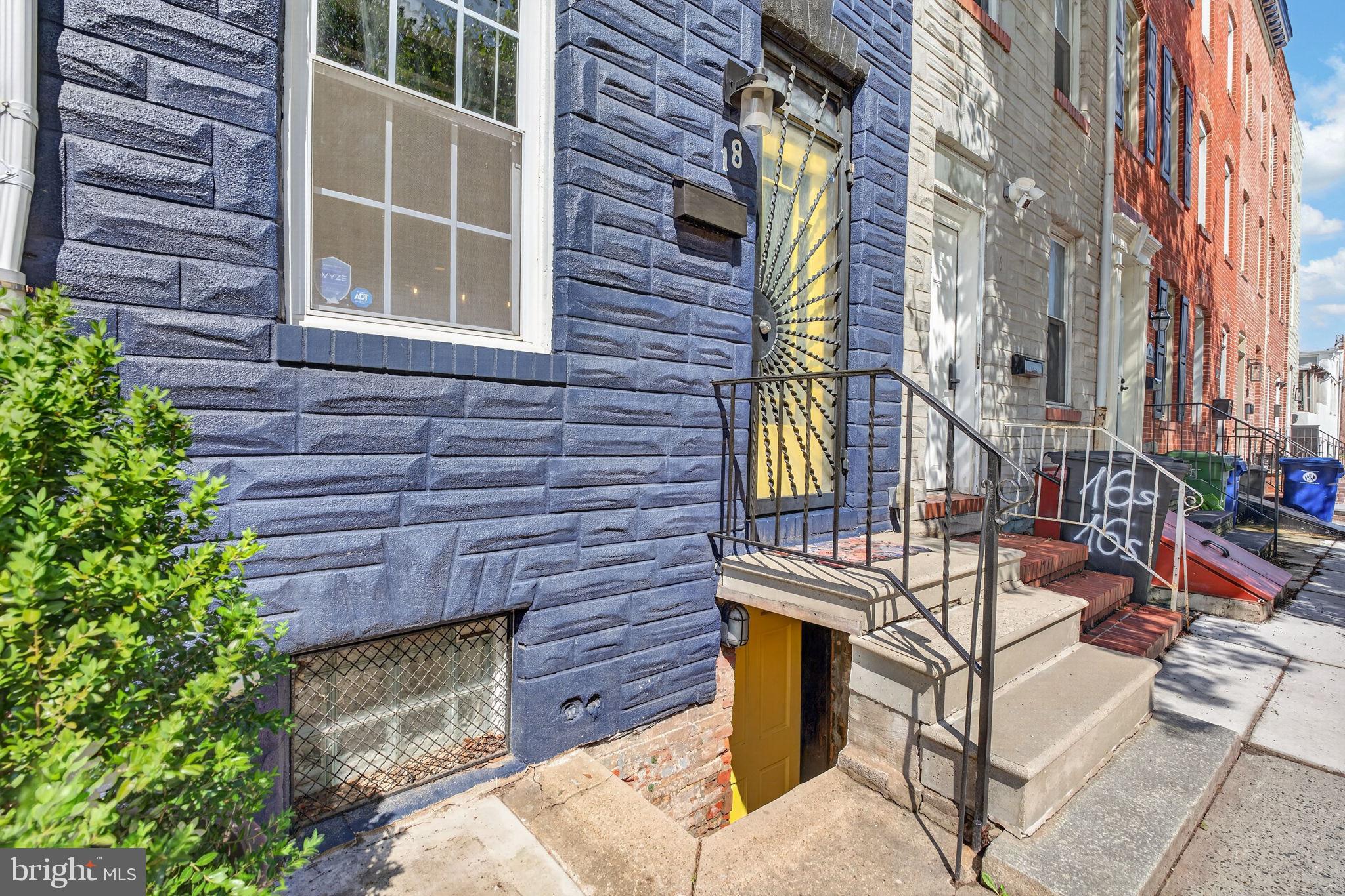 18 South Washington Street Baltimore, MD 21231 - Photo 6 of 57 a front view of a house with a yard