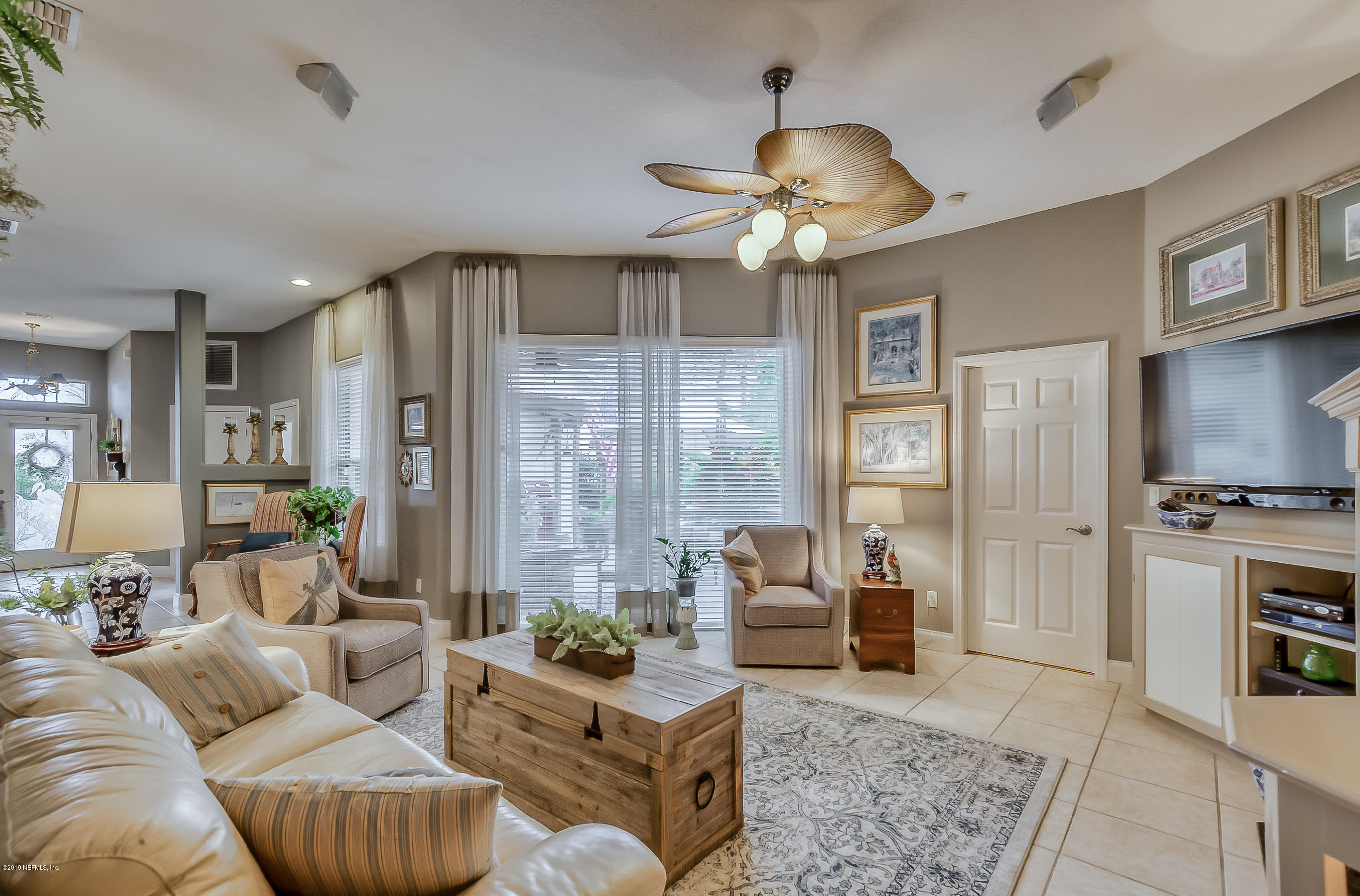 200 Cedar Ridge Circle St. Augustine, FL 32080 - Photo 1 of 41 a living room with furniture a chandelier and a dining table