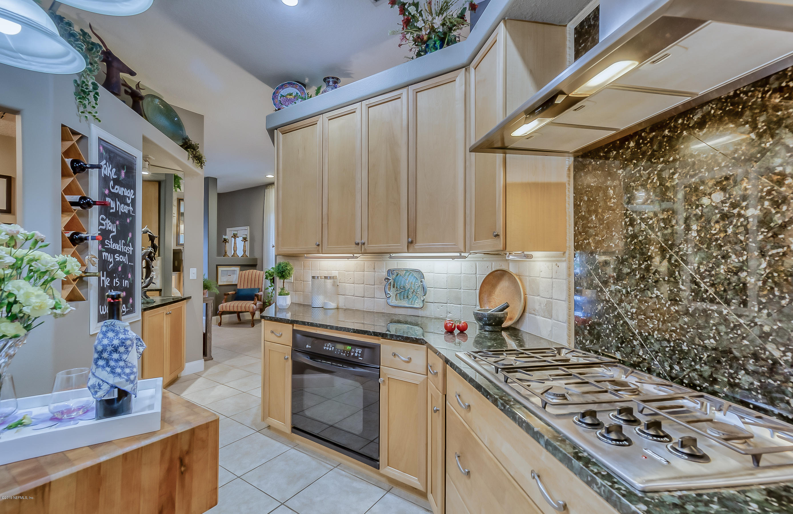 200 Cedar Ridge Circle St. Augustine, FL 32080 - Photo 11 of 41 a kitchen with stainless steel appliances a stove a sink and a refrigerator