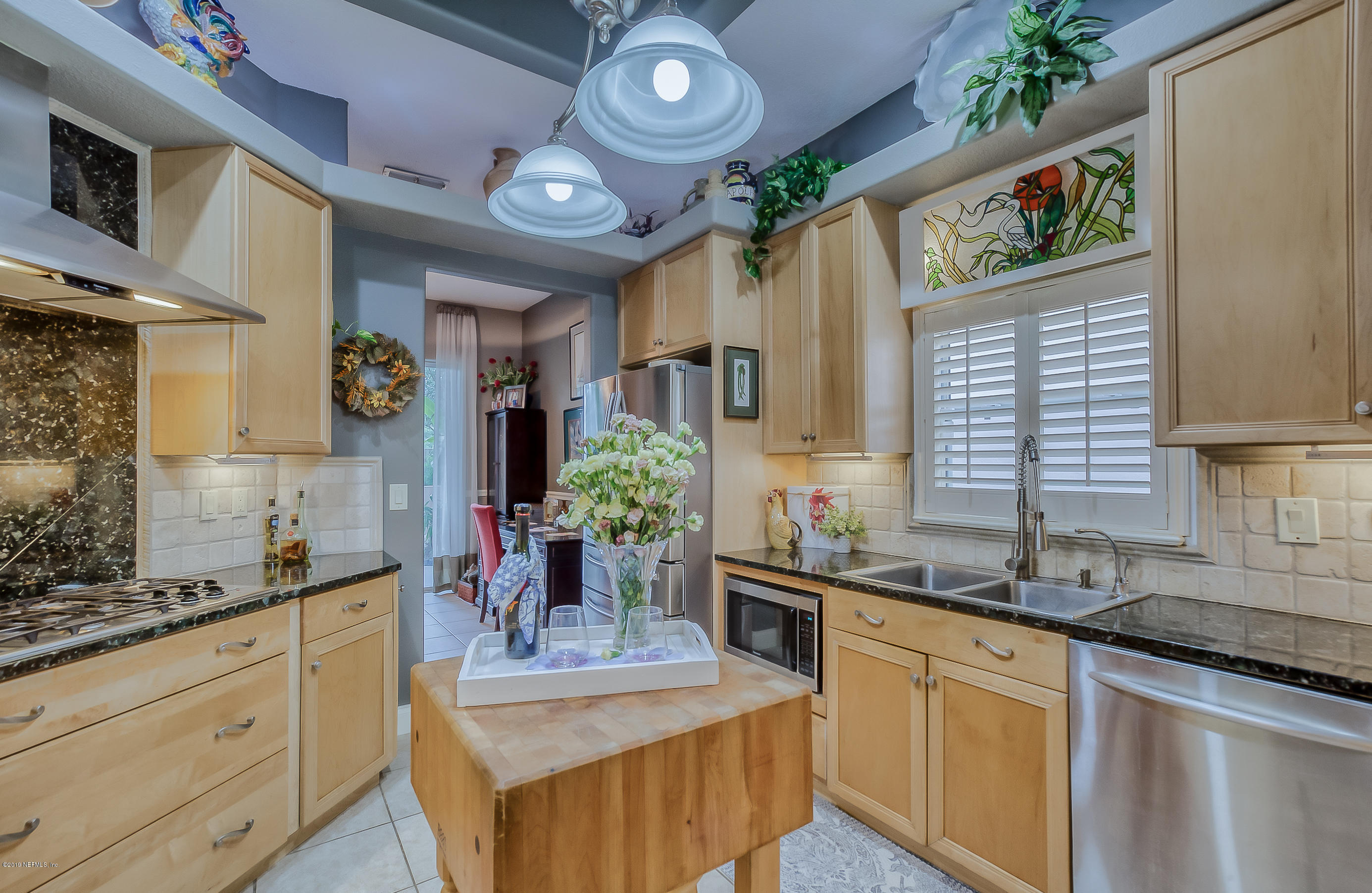 200 Cedar Ridge Circle St. Augustine, FL 32080 - Photo 13 of 41 a kitchen with sink stove and cabinets