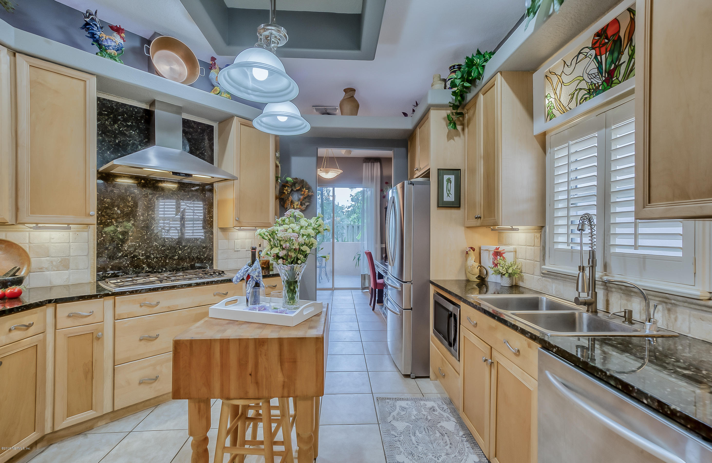 200 Cedar Ridge Circle St. Augustine, FL 32080 - Photo 23 of 41 a view of a kitchen area with furniture and chandelier