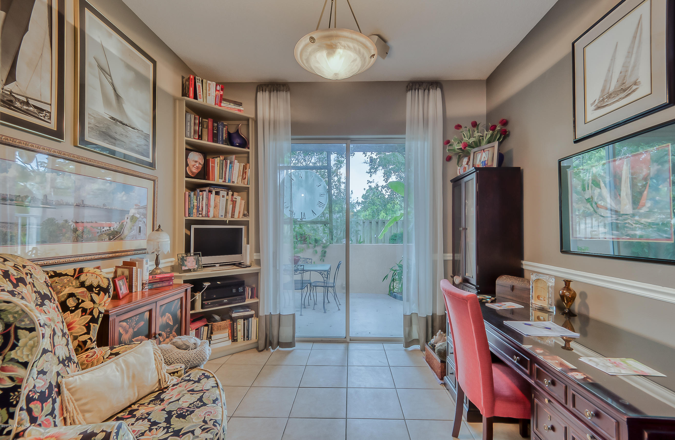 200 Cedar Ridge Circle St. Augustine, FL 32080 - Photo 26 of 41 a view of a workspace with furniture and a window
