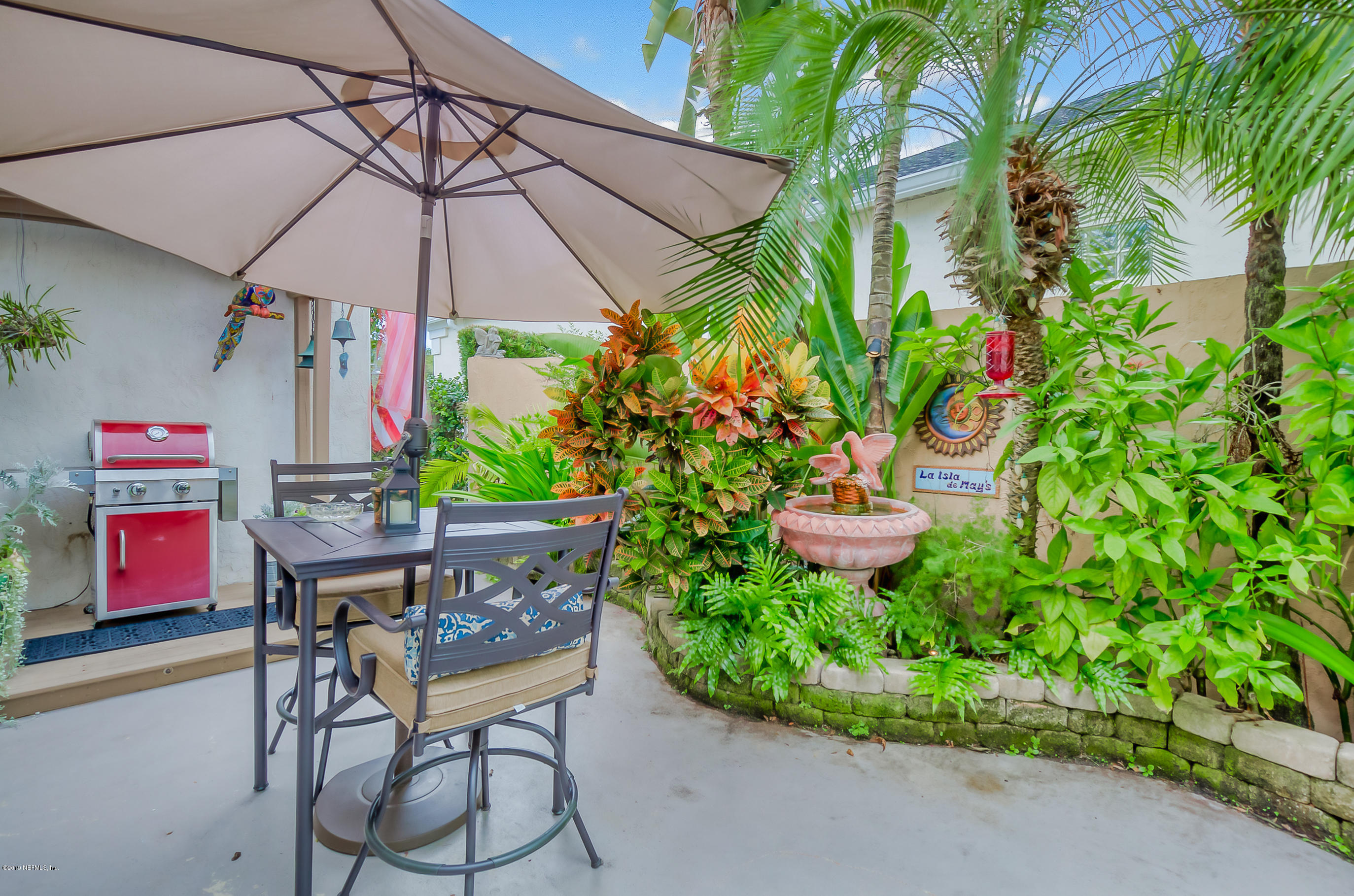 200 Cedar Ridge Circle St. Augustine, FL 32080 - Photo 31 of 41 a patio with a table and chairs