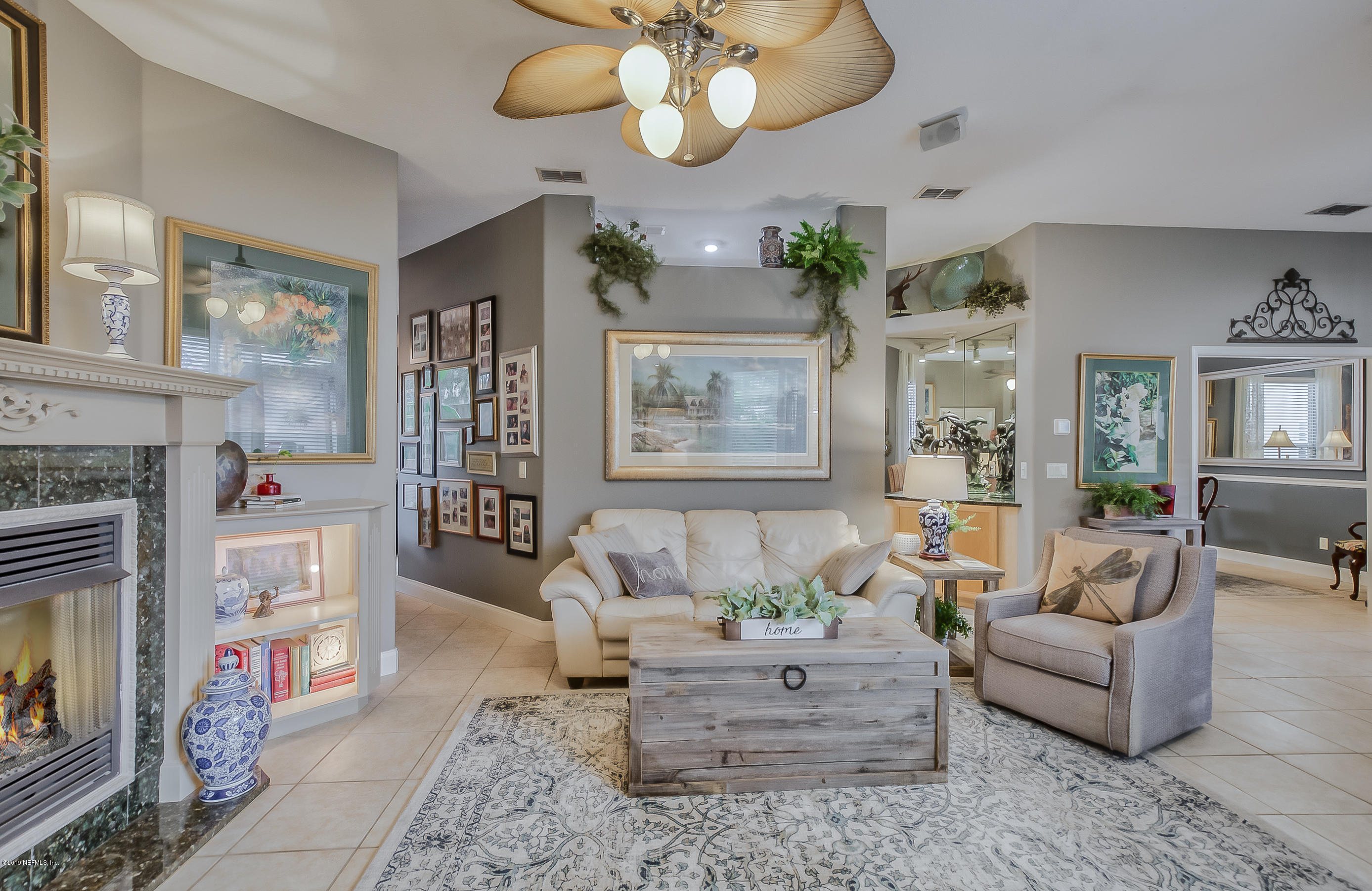 200 Cedar Ridge Circle St. Augustine, FL 32080 - Photo 5 of 41 a living room with furniture and a fireplace