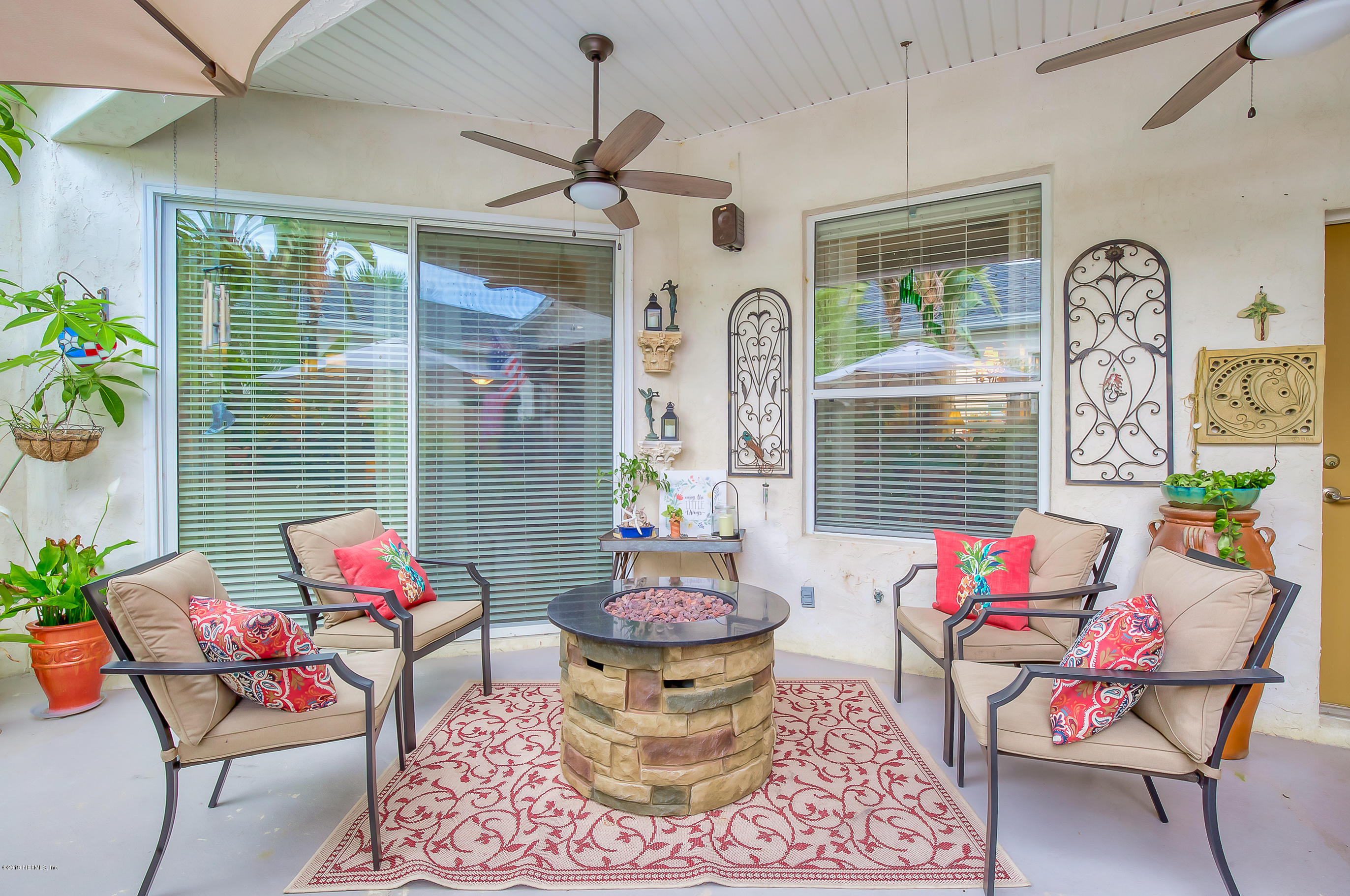 200 Cedar Ridge Circle St. Augustine, FL 32080 - Photo 9 of 41 a living room with furniture and a large window