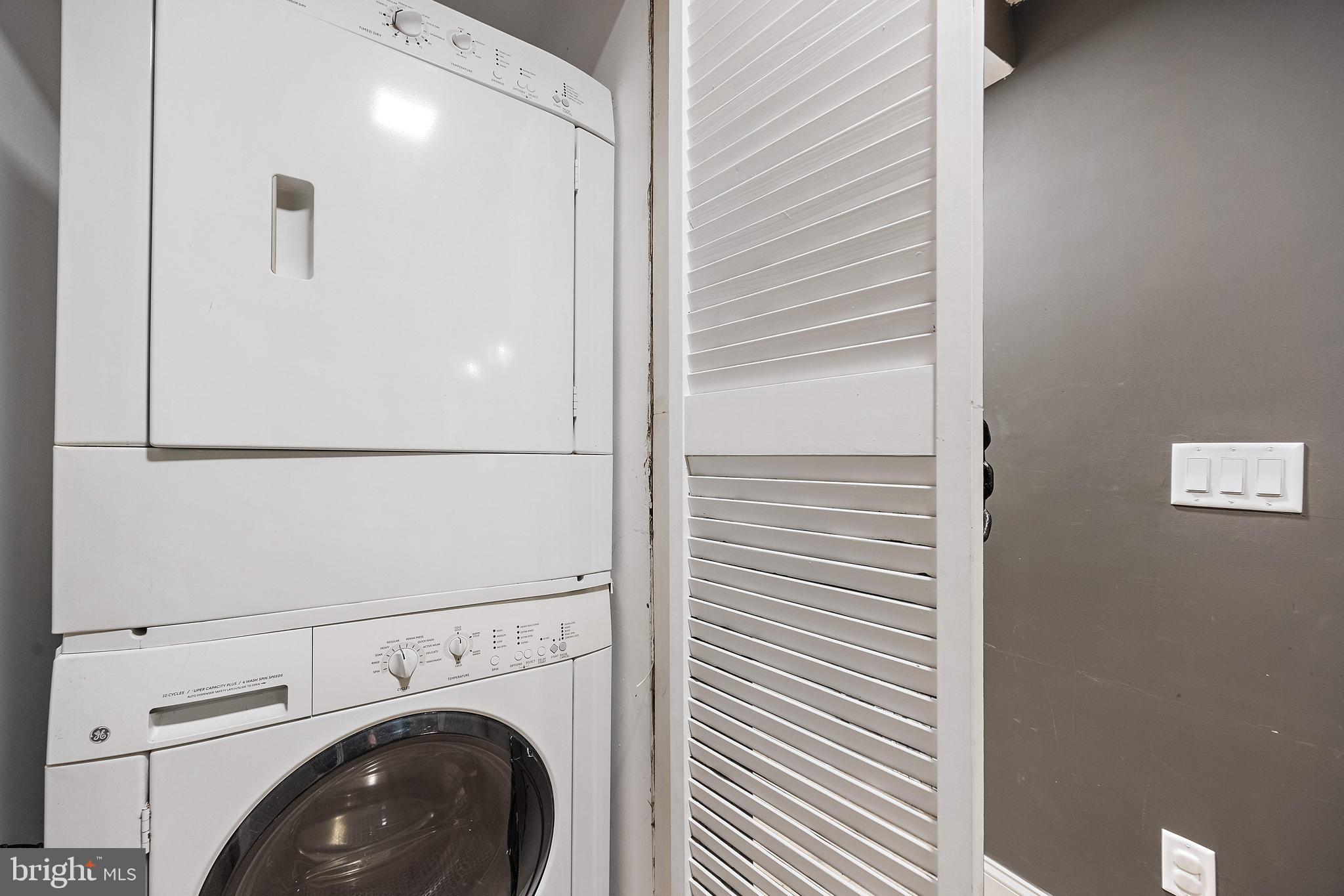49 Bancroft Mills Road, Unit 2B Wilmington, DE 19806 - Photo 16 of 18 a utility room with dryer and washer