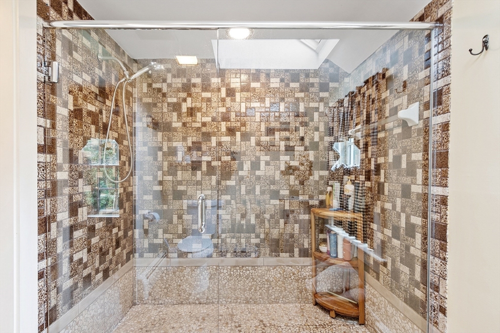10 Garrison Street Groveland, MA 01834 - Photo 20 of 42 a bathroom with a shower curtain