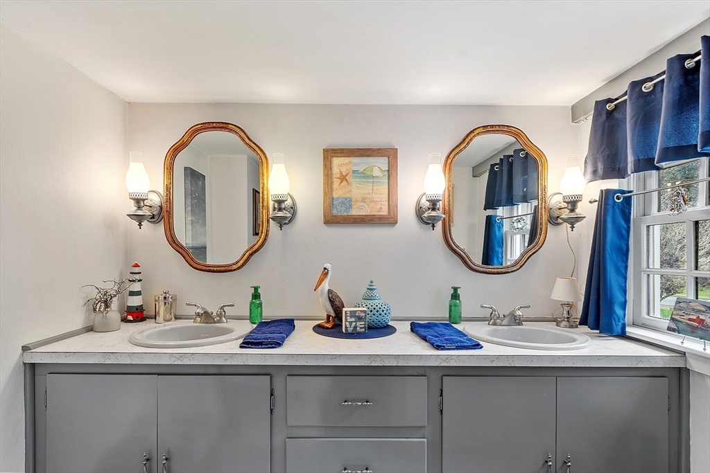 10 Garrison Street Groveland, MA 01834 - Photo 23 of 42 a bathroom with a sink and a mirror