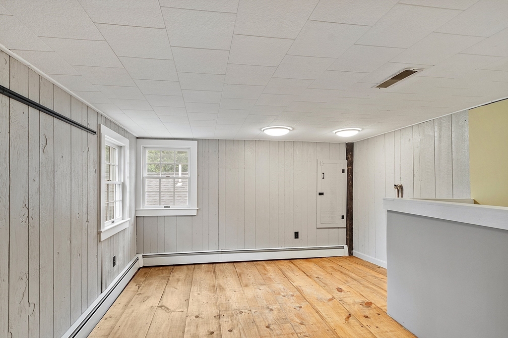 10 Garrison Street Groveland, MA 01834 - Photo 25 of 42 a view of an empty room with a window and wooden floor