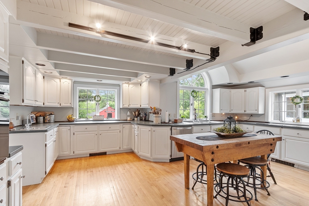 10 Garrison Street Groveland, MA 01834 - Photo 4 of 42 a kitchen with granite countertop a sink and white appliances