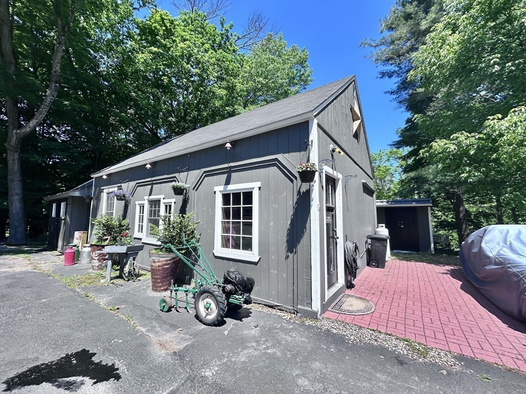 10 Garrison Street Groveland, MA 01834 - Photo 41 of 42 a view of a house with backyard sitting area and garden