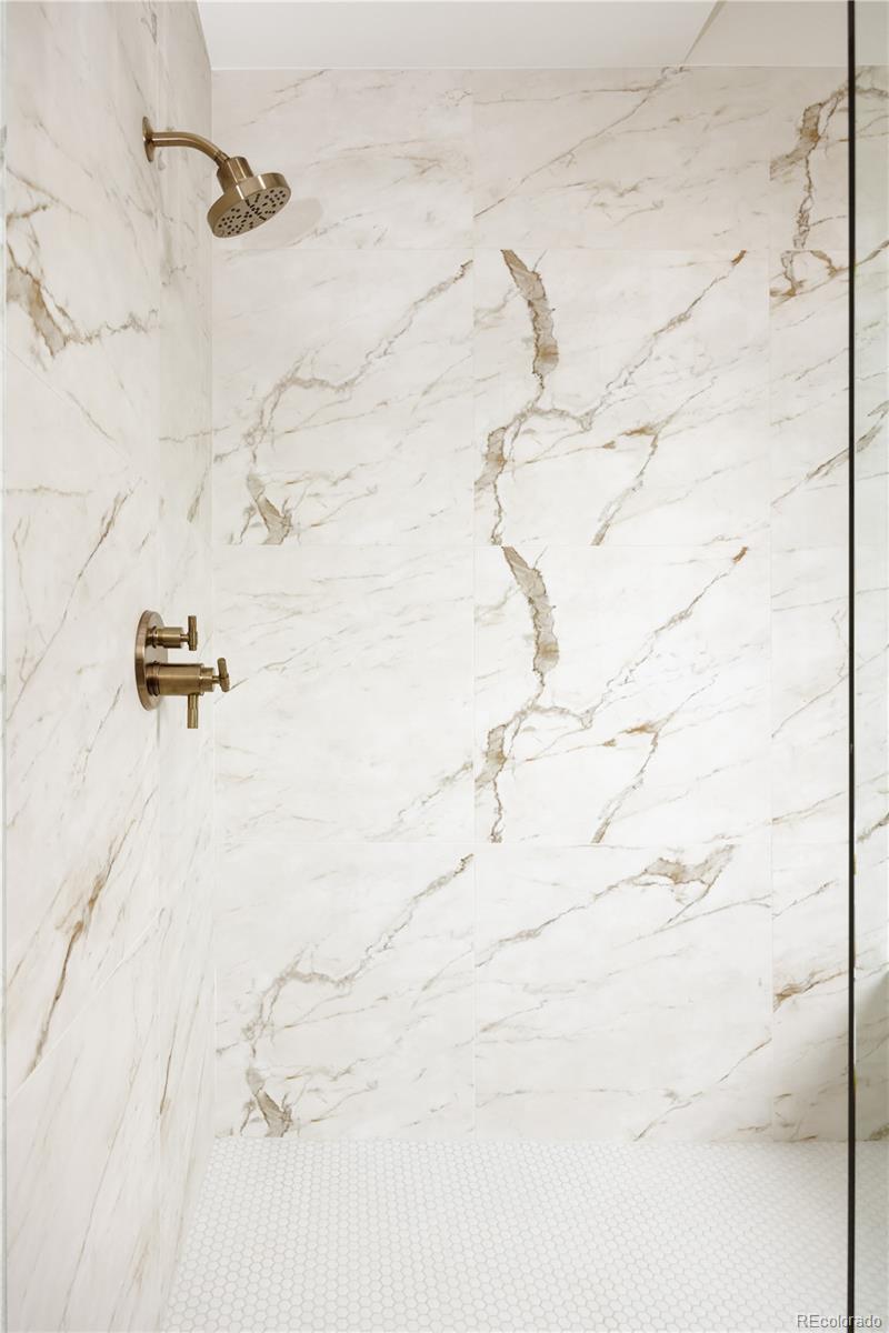 3076 Fenton Street Wheat Ridge, CO 80214 - Photo 24 of 37 a view of a bathroom shower