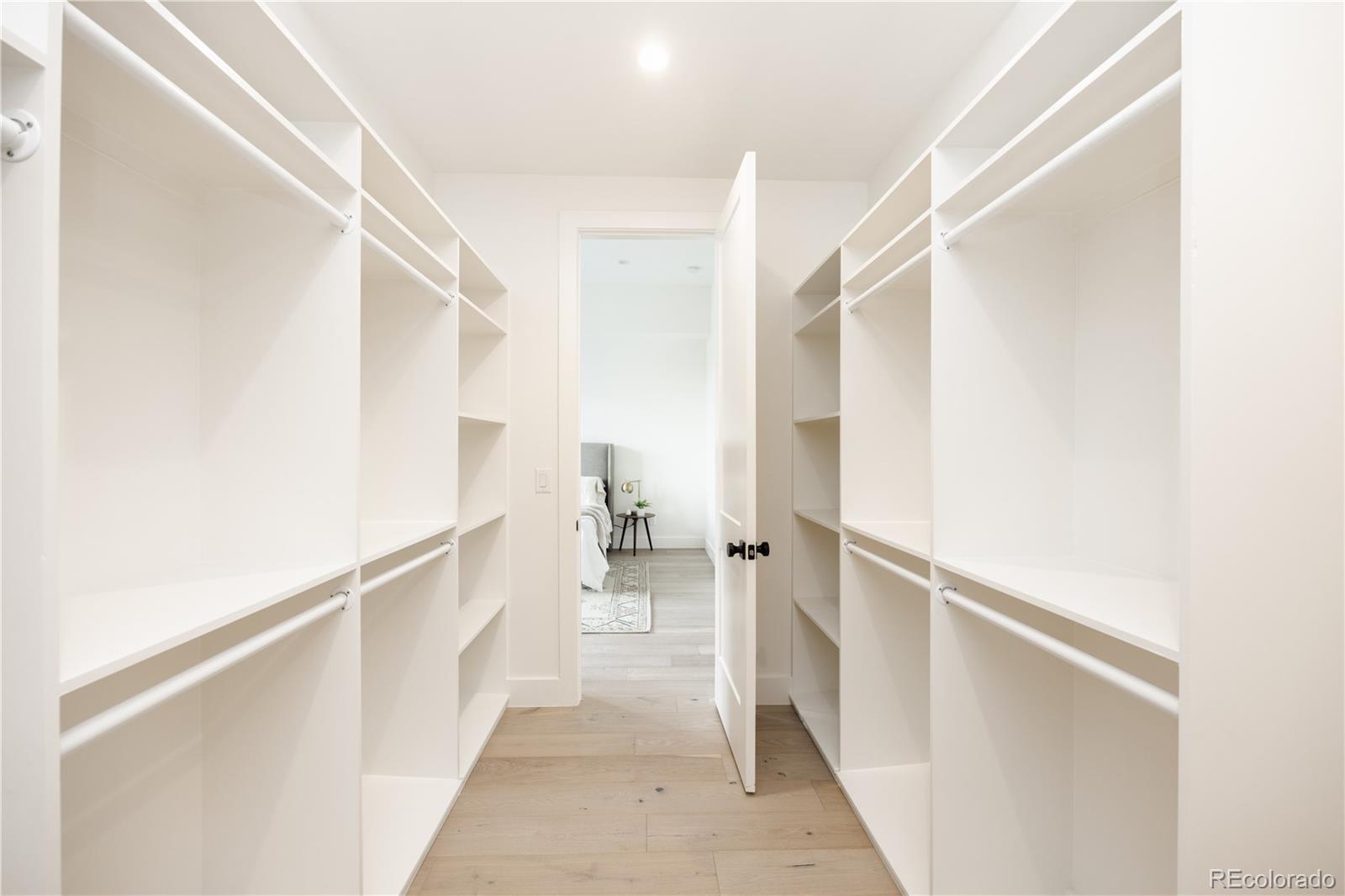 3076 Fenton Street Wheat Ridge, CO 80214 - Photo 25 of 37 a view of a hallway with white walls and stairs