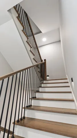 a kitchen with kitchen island a sink stainless steel appliances and cabinets