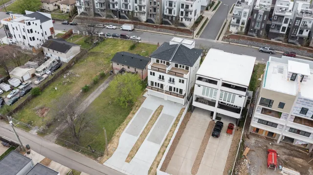 a aerial view of a house with a swimming pool