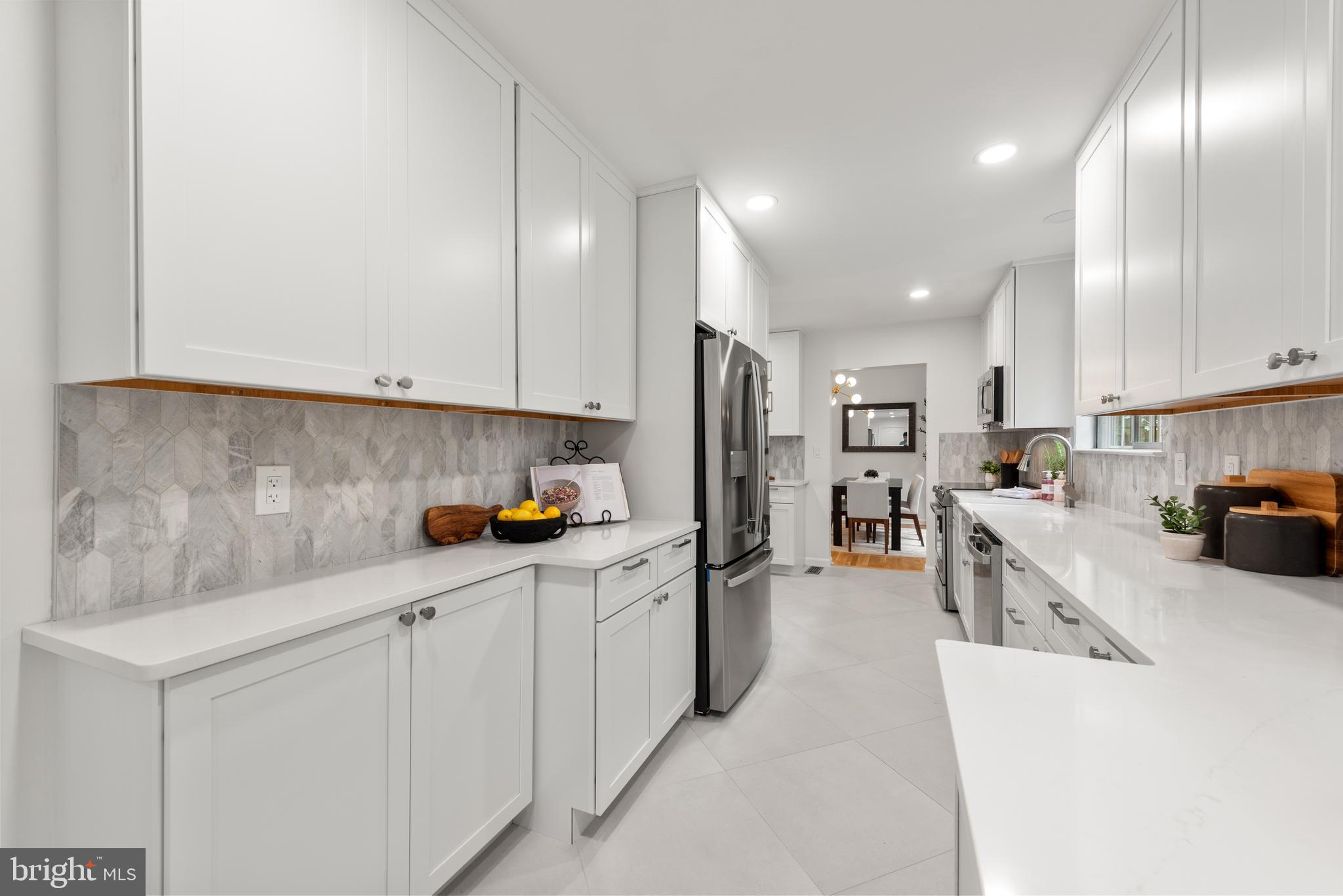 1802 Cranberry Lane Reston, VA 20191 - Photo 18 of 75 Quartz countertops and marble backsplash