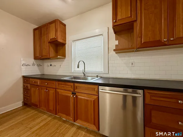a kitchen with sink and cabinets
