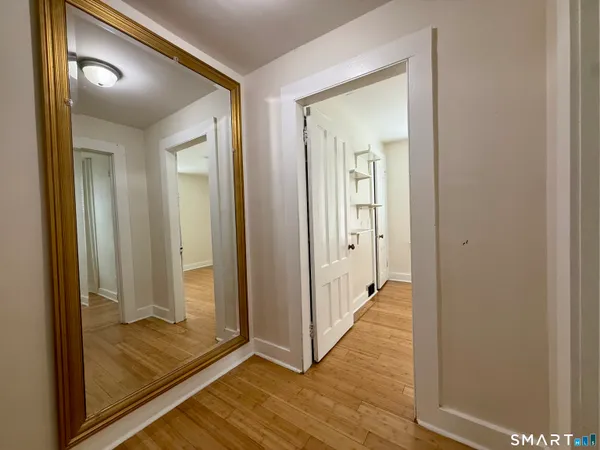 a bathroom with a sink a toilet and a window