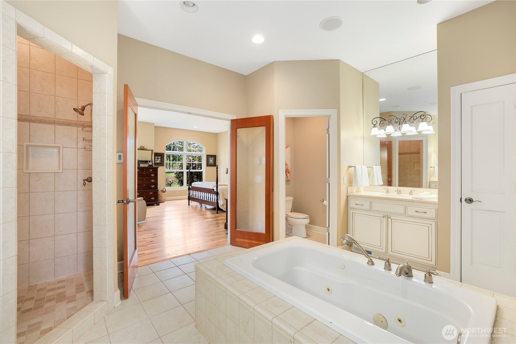 7007 Muirkirk Lane Southwest Port Orchard, WA 98367 - Photo 13 of 40 a bathroom with a tub shower and sink
